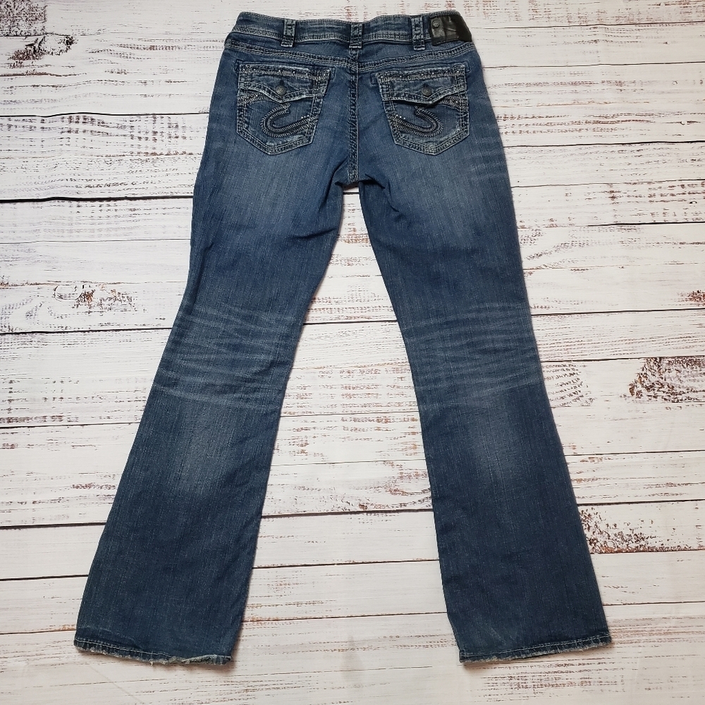 Silver Jeans Aiko Mid Boot Cut Distressed with embroidery and studs.